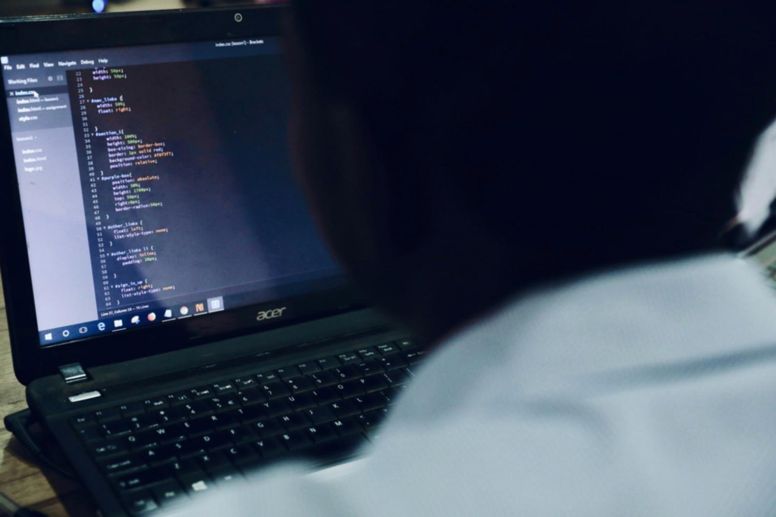 Security analyst reviewing application vulnerability data on screen